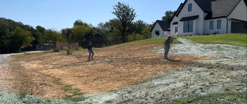 A crew performing a hydroseeding service on a property in Fort Worth, TX.