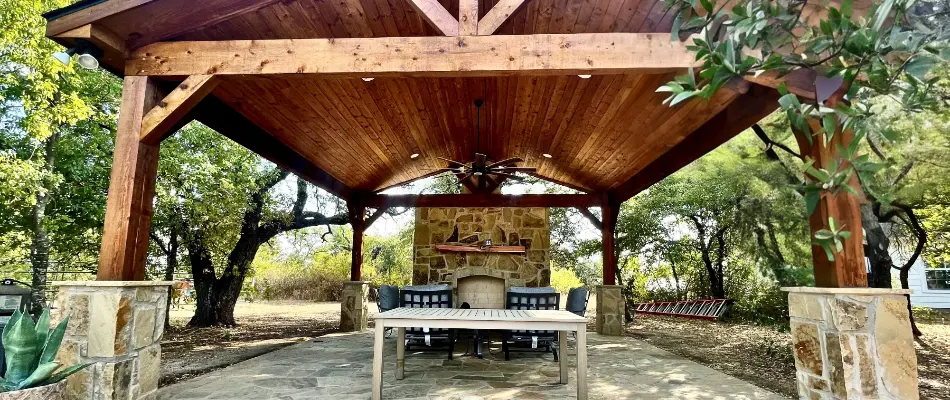 Pavilion in River Oaks, TX, with an outdoor fireplace.