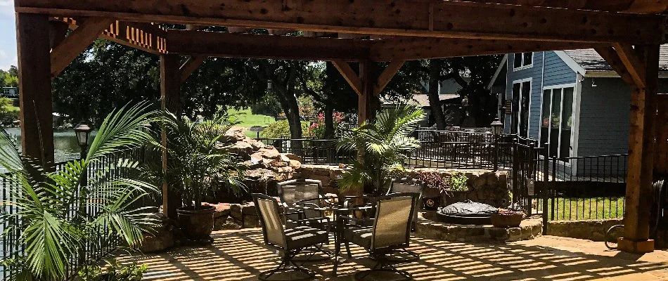 Pergola on a patio in Watauga, TX, with furniture.